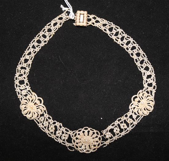 A 19th century seed pearl choker necklace with three flower head motifs 14.5in